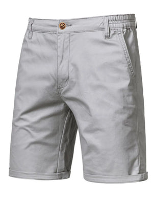Gray chino shorts with elastic waist and button fly, cuffed hem.