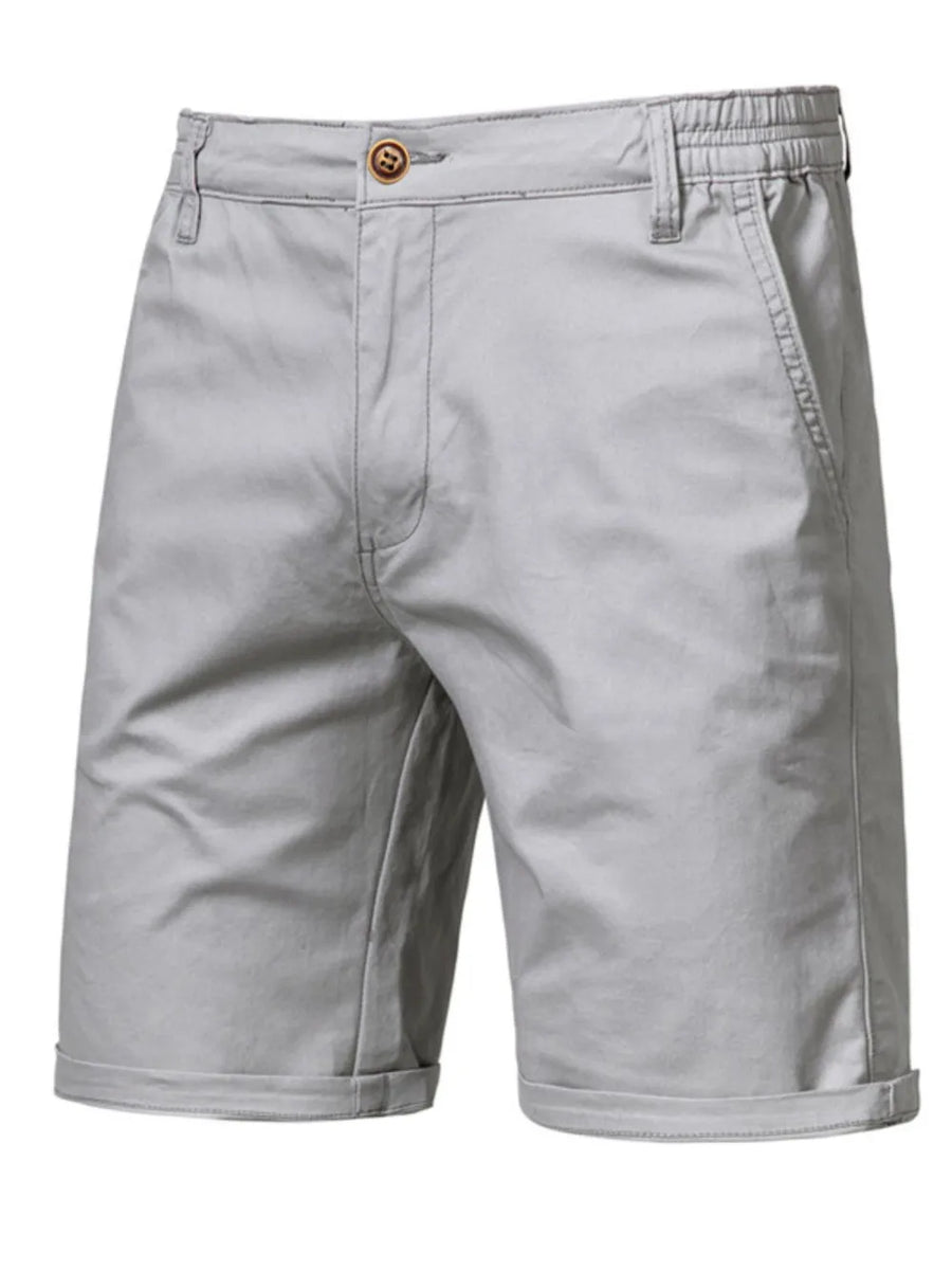 Gray chino shorts with elastic waist and button fly, cuffed hem.