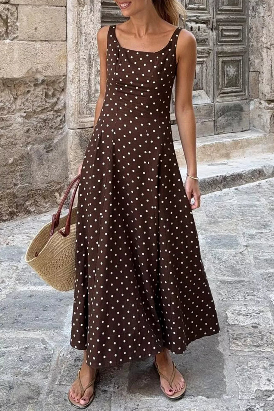 Brown polka dot sleeveless midi dress with square neckline and flared skirt