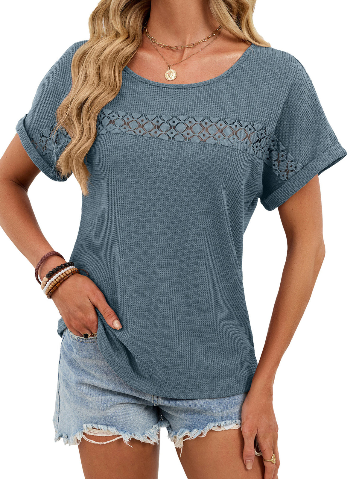 Blue waffle knit short sleeve tee with lace detail across the chest and sleeves.