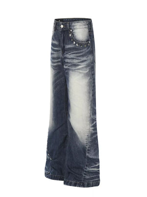 Blue distressed bootcut jeans with studded accents on the pockets.