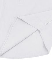 White cotton button-down shirt detail showing hem and side seam construction
