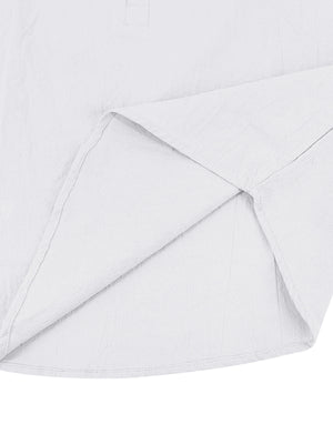 White cotton button-down shirt detail showing hem and side seam construction