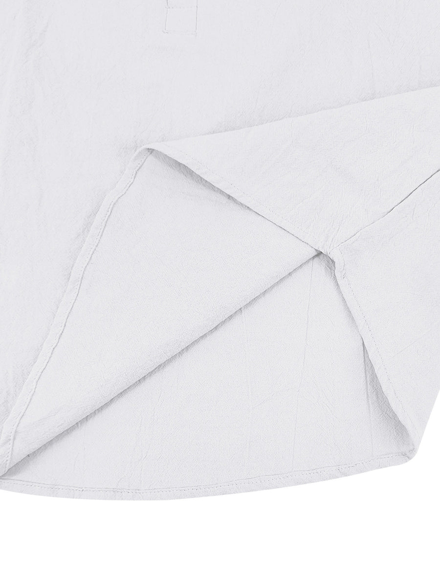 White cotton button-down shirt detail showing hem and side seam construction