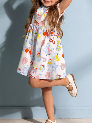 White cotton a-line toddler dress with playful summer print, short sleeves, and round neckline.