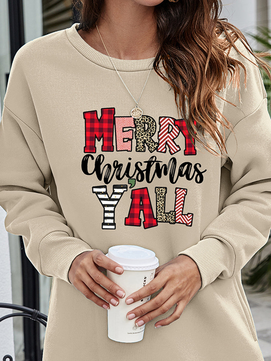 Beige oversized sweatshirt with Merry Christmas Y'all graphic in plaid, leopard and striped patterns.