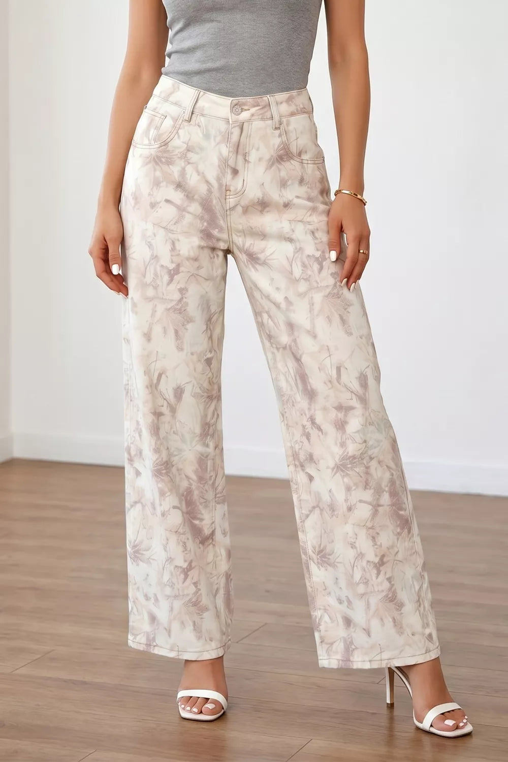 Abstract beige high-waisted wide-leg cotton jeans with a tie-dye pattern.