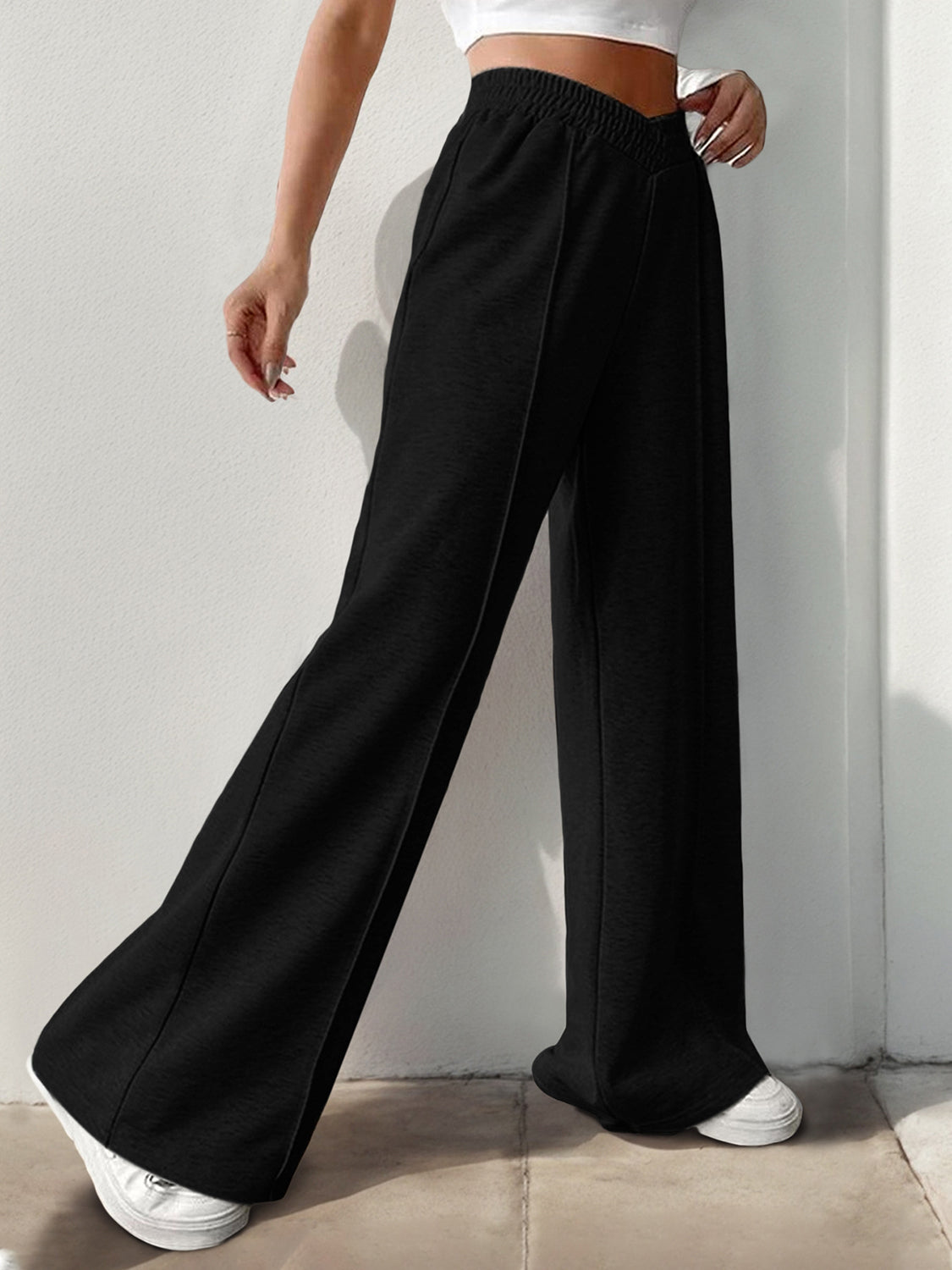 Black palazzo sweatpants with V-waistline and center seams