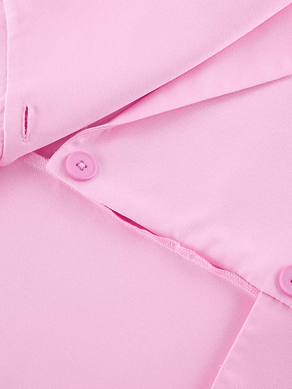 95% polyester, 5% spandex Care instructions: Machine wash cold two-piece set in light pink with fitted top, wide-leg bottom