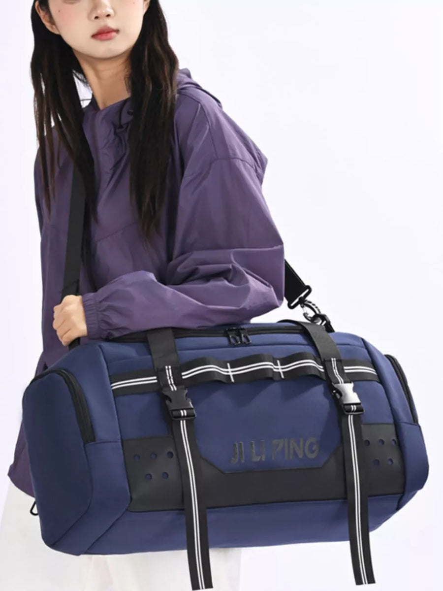 Spacious blue Oxford cloth travel tote bag with compression straps and black accents.