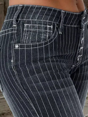Black pinstripe maternity flare jeans with button fly and white stitching.