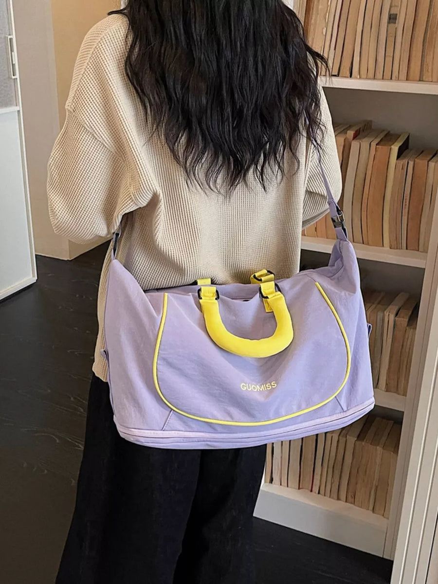 Premium Oxford Cloth Duffle Bag in purple with yellow trim and handles.