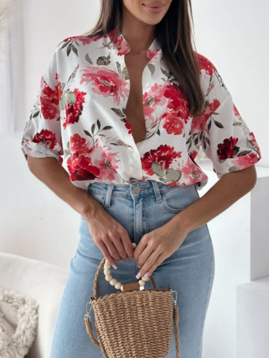 Floral print blouse with mandarin collar and button front, shown in white with red flowers.