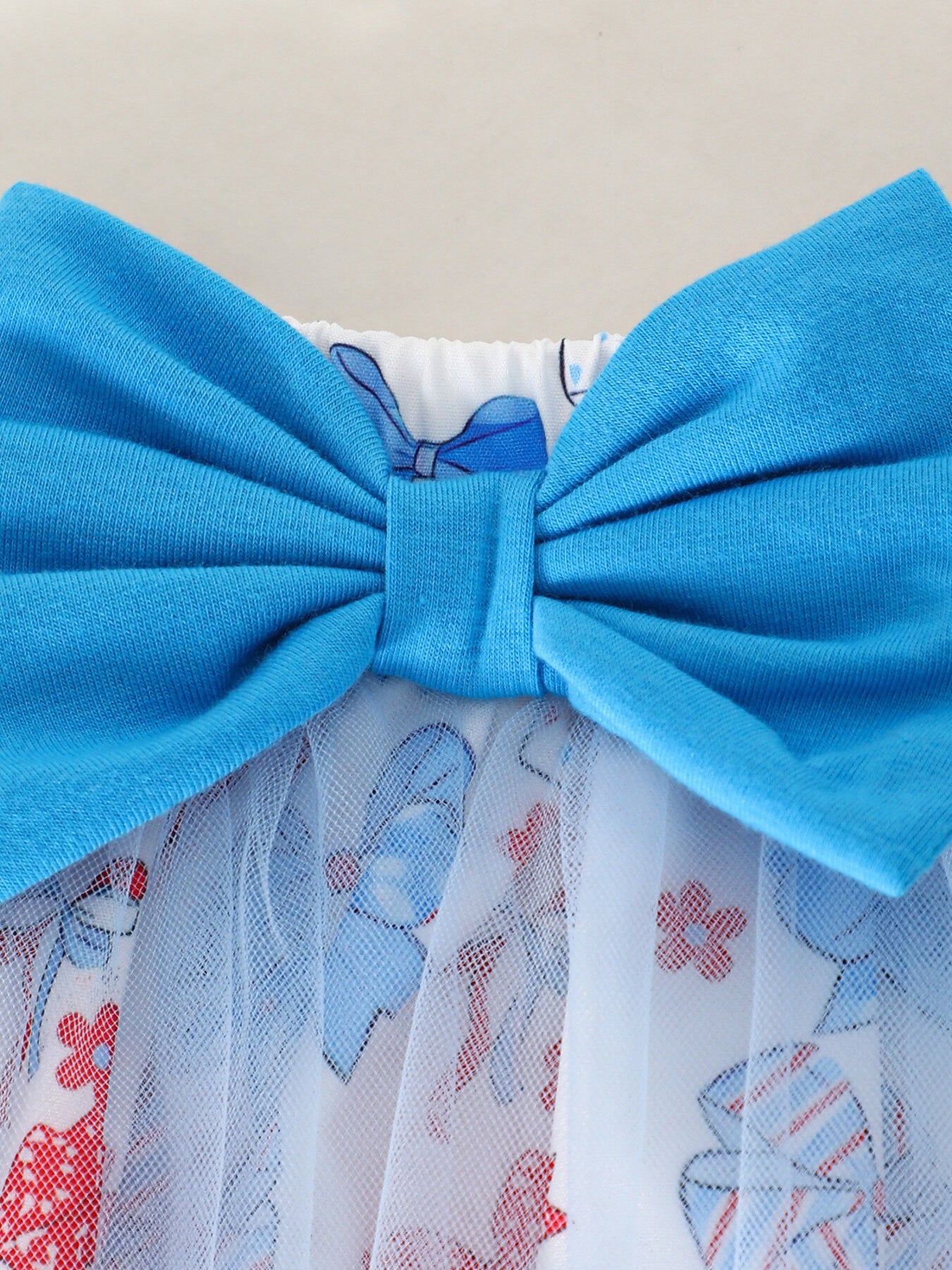 Baby outfit with blue bow and patriotic print tulle skirt