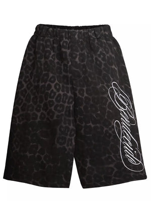 Grey leopard print sweatpants with white script logo detail on leg.