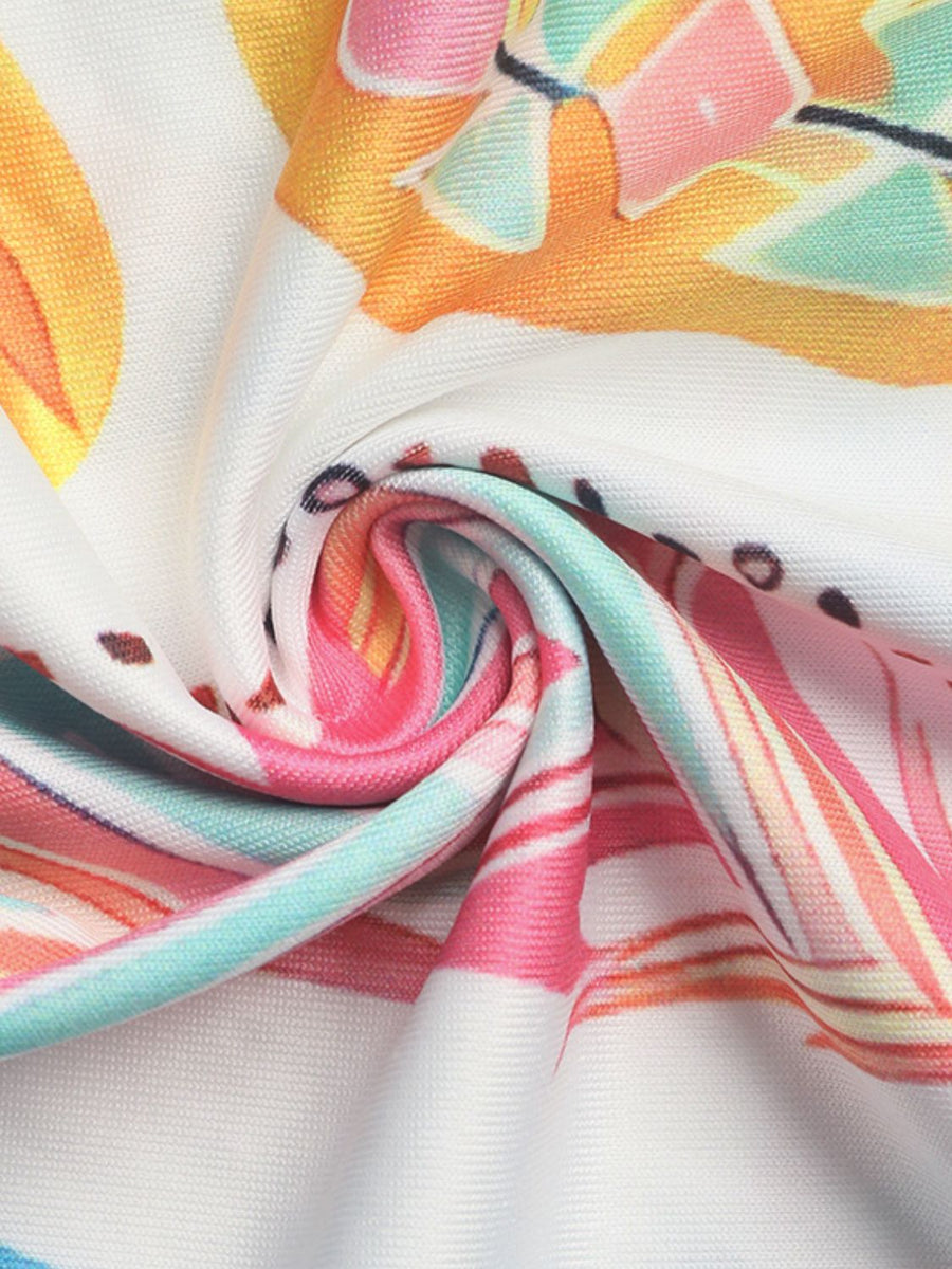 White blouse with colorful feather print and crochet detail