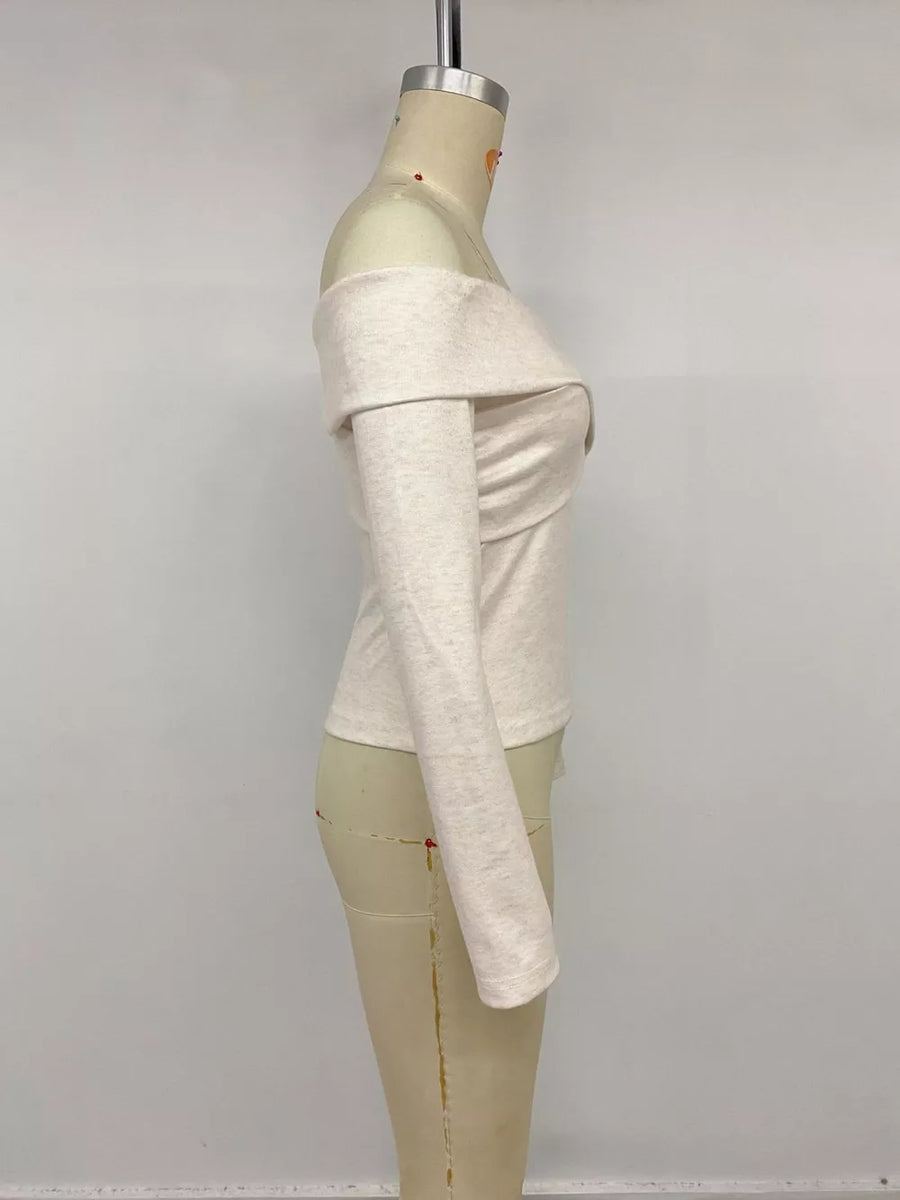Off-the-shoulder top in light heathered knit with long sleeves and a draped neckline.