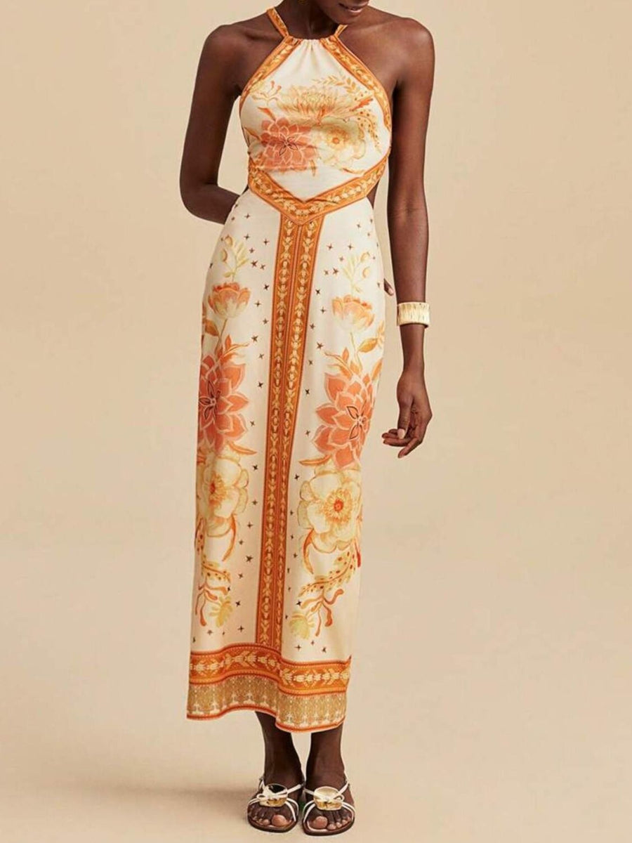Floral print backless maxi dress with halter neck and orange floral details.