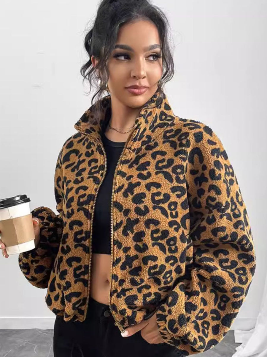 Caramel leopard print sherpa bomber jacket with a zip front and stand-up collar.
