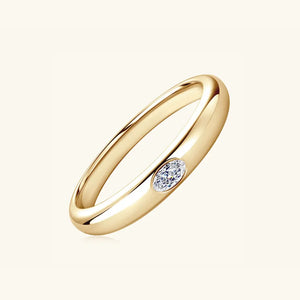 Gold band ring with oval moissanite accent