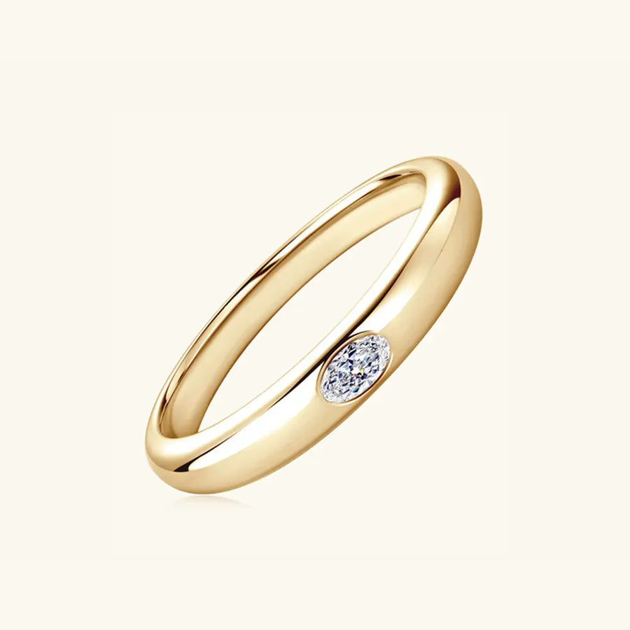 Gold band ring with oval moissanite accent