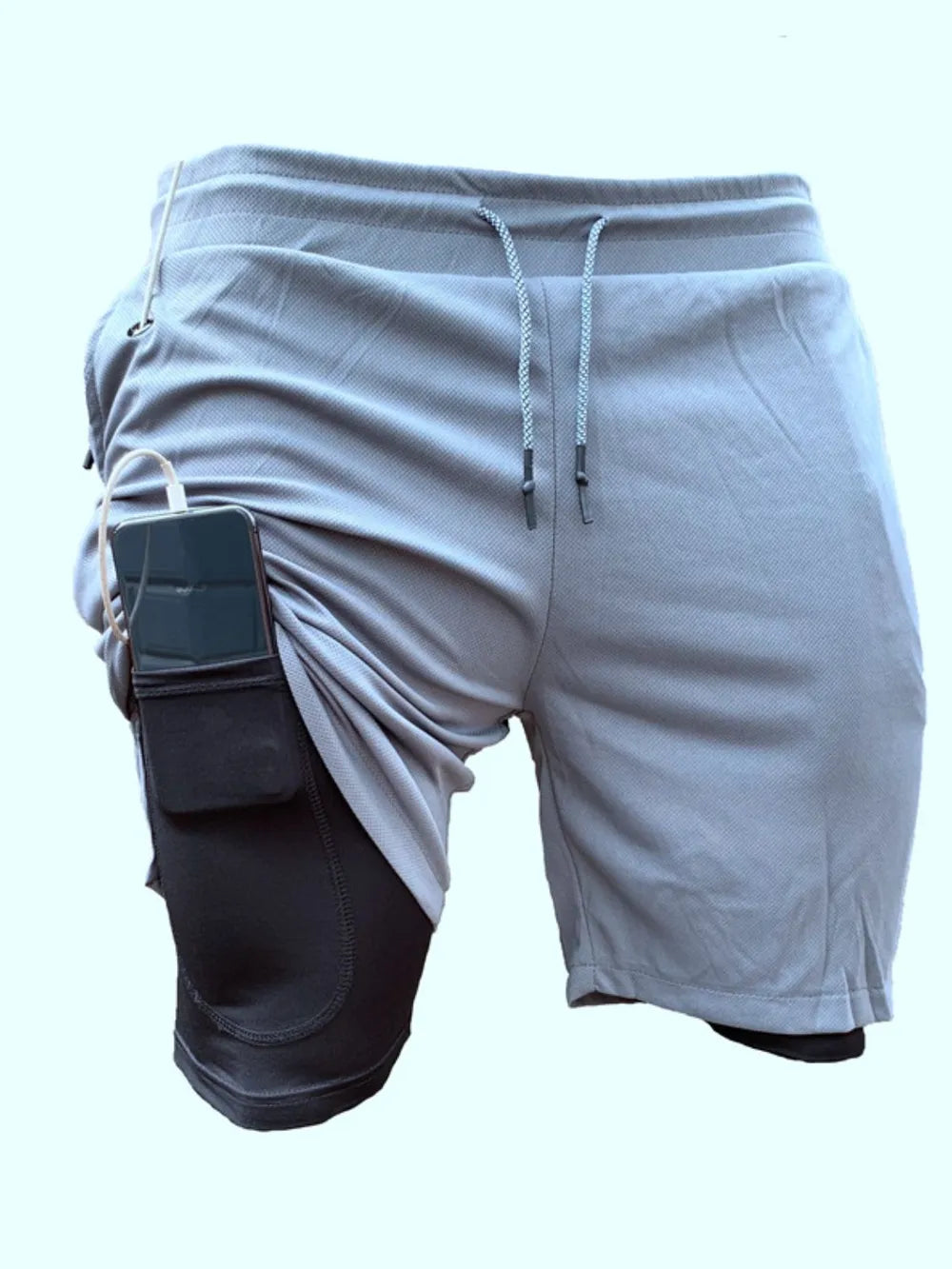 Gray dual-layered performance shorts with black compression liner and phone pocket