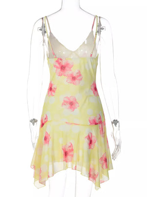 Yellow floral asymmetrical mini dress with ruffled hem and V-neck.