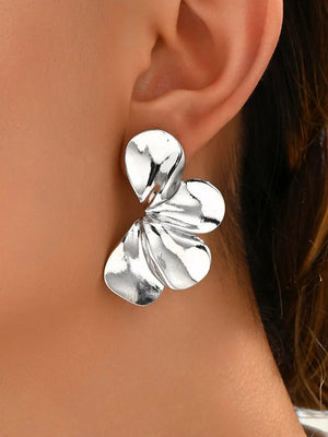 Stainless Steel Care instructions: Avoid wearing during exercise, as sweat will earrings in Silver with sculptural silhouette