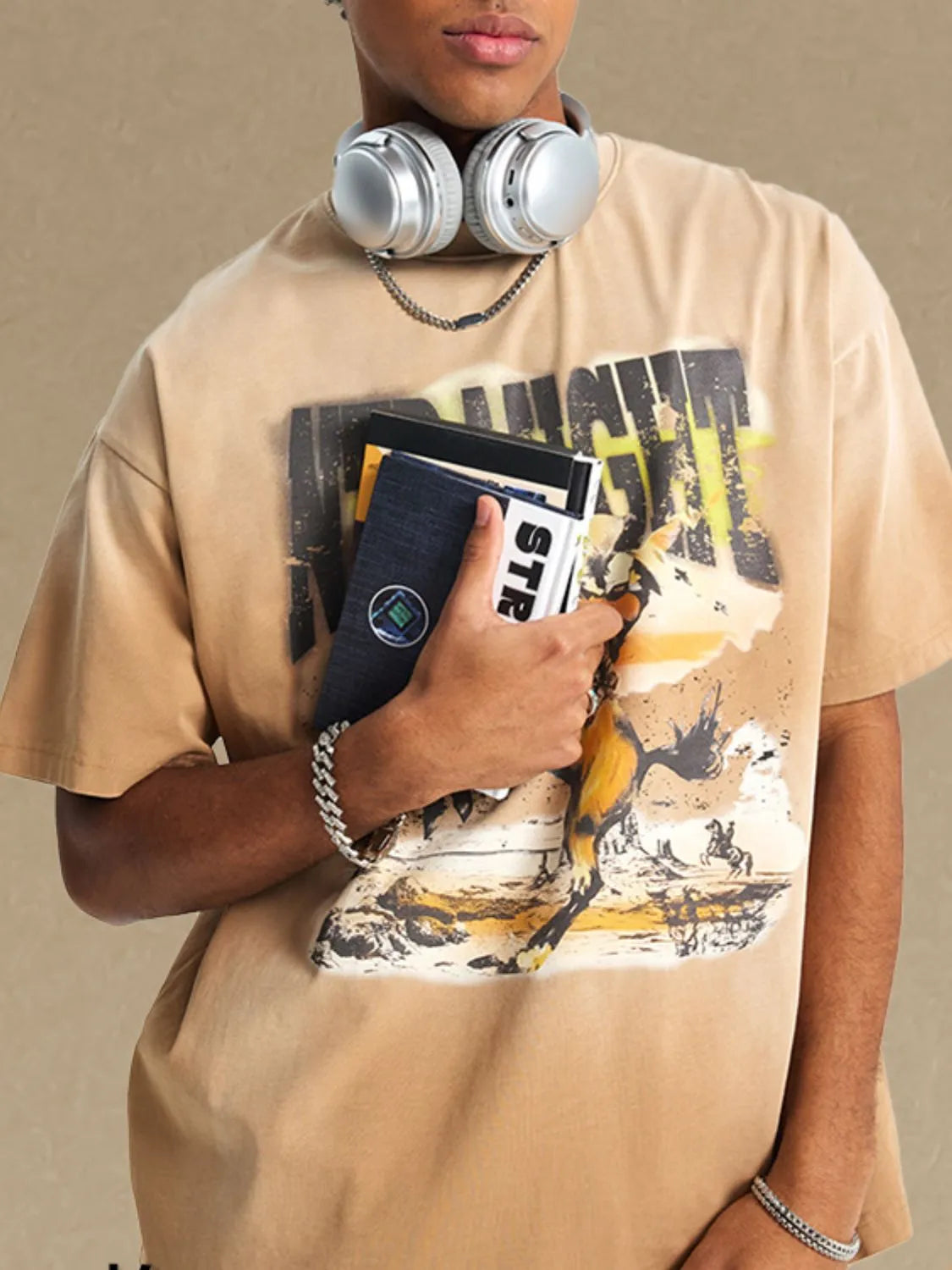 Vintage graphic oversized tee in khaki with a desert landscape print and distressed details.