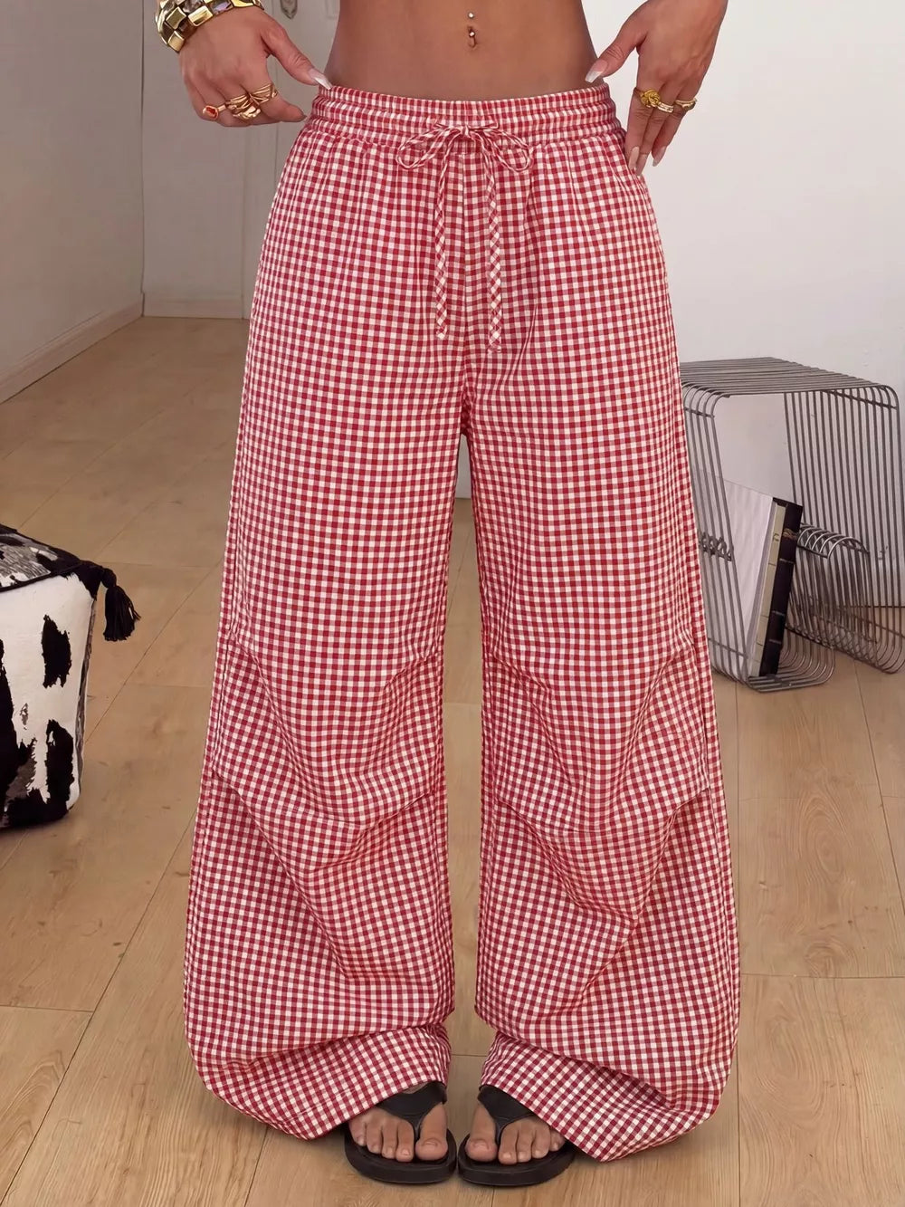wide-leg pants in red featuring drawstring waist and flared fit