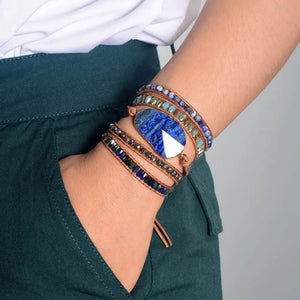 Lapis Lazuli wrap bracelet with blue and crystal beads on leather cord.