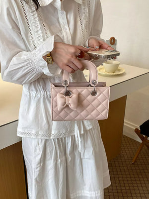 Blush Pink crossbody bag featuring quilted and quilted