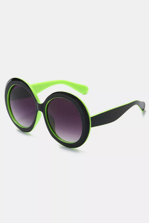 Chic oversized round sunglasses with black frames and neon green accents.