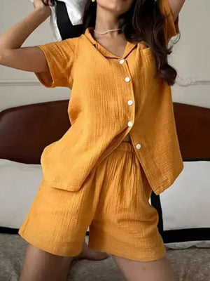 Yellow cotton button-up pajama set with collared shirt and shorts.