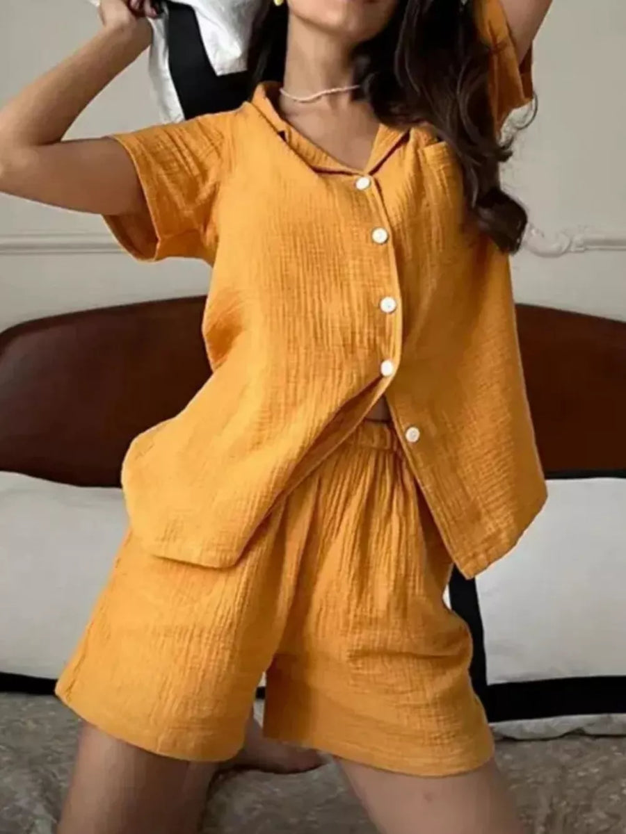 Yellow cotton button-up pajama set with collared shirt and shorts.
