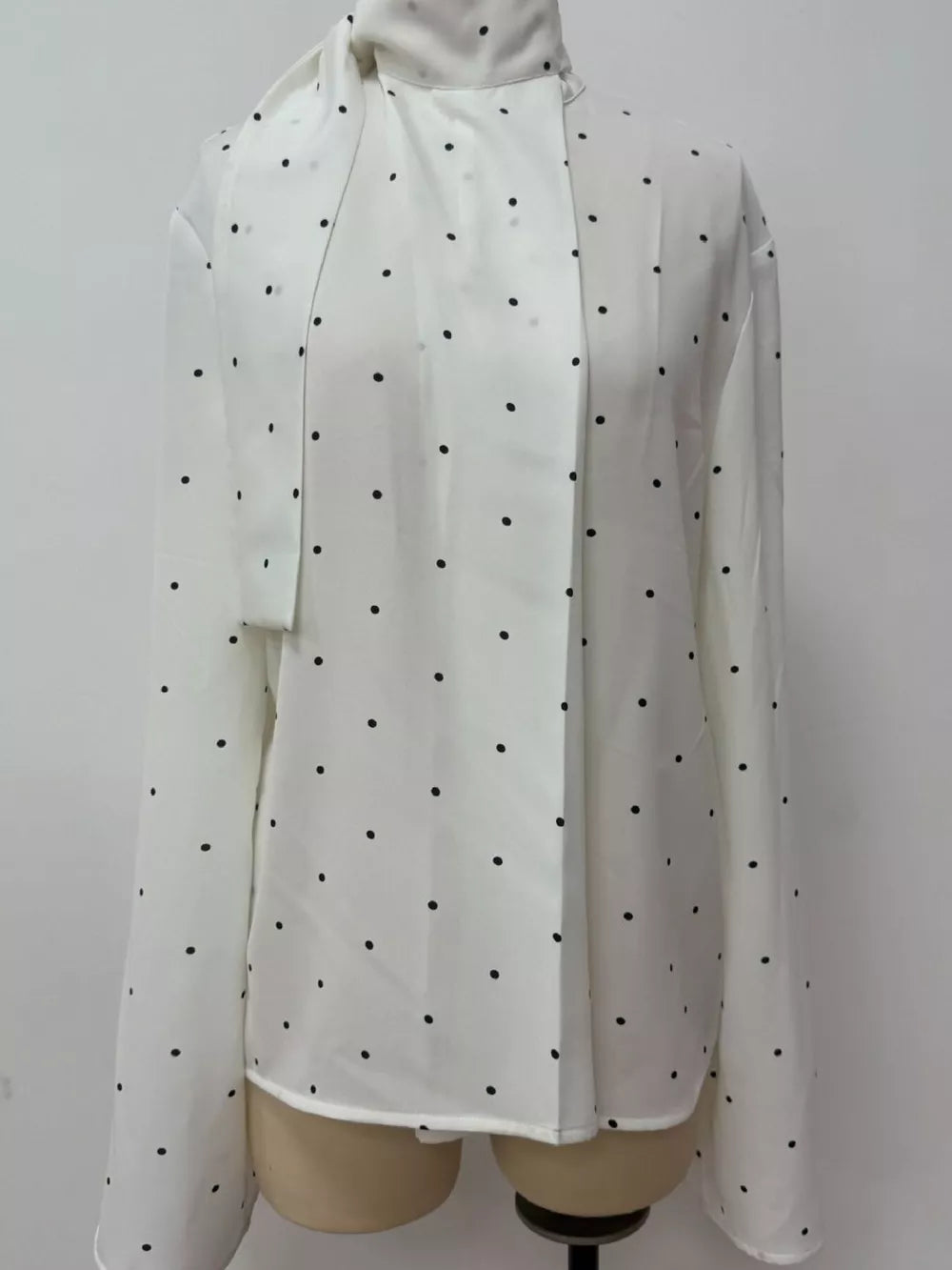 blouse featuring polka dot in White with 100% polyester Care instructions: Machine wash cold texture