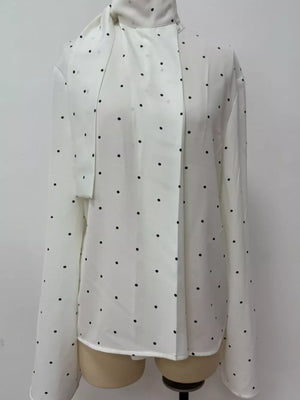 blouse featuring polka dot in White with 100% polyester Care instructions: Machine wash cold texture