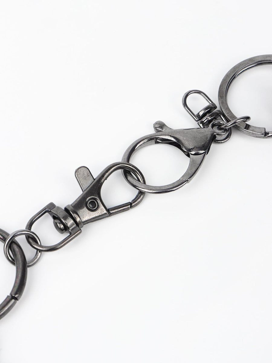 Spiked chain harness belt in black aluminum with lobster clasps and keyring details.