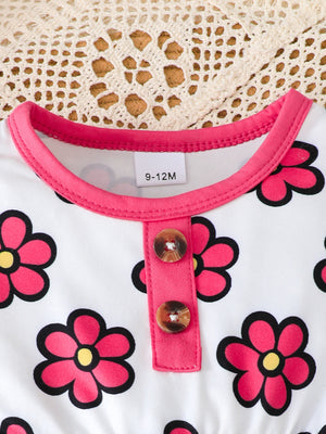 hot pink peplum top featuring decorative button and floral