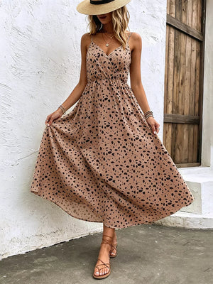 Taupe floral print spaghetti strap midi dress with adjustable straps and a-line cut.