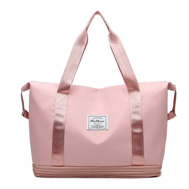 Dusty Pink expandable travel tote bag with contrast trim and zipper detail.