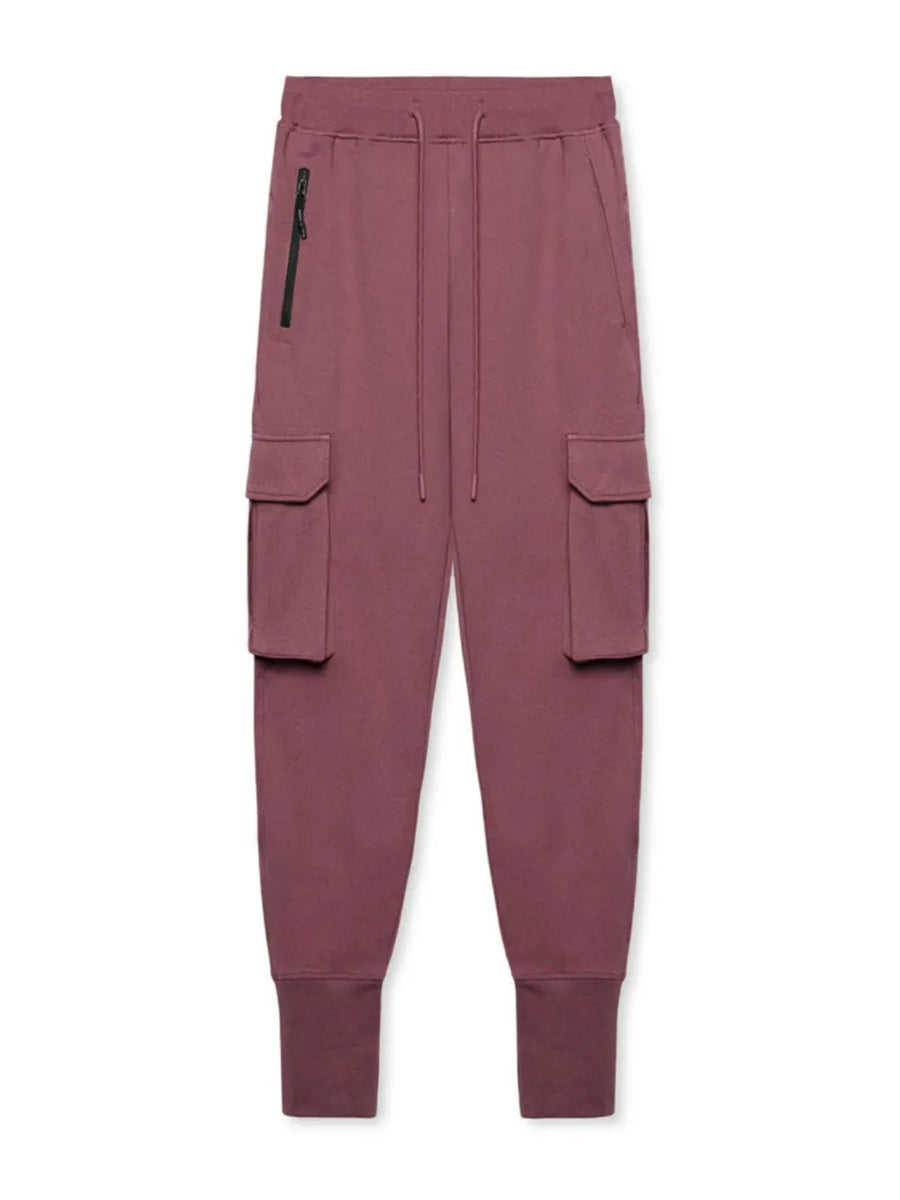 Dusty pink Tech-Knit cargo joggers with zip pocket and drawstring waist.