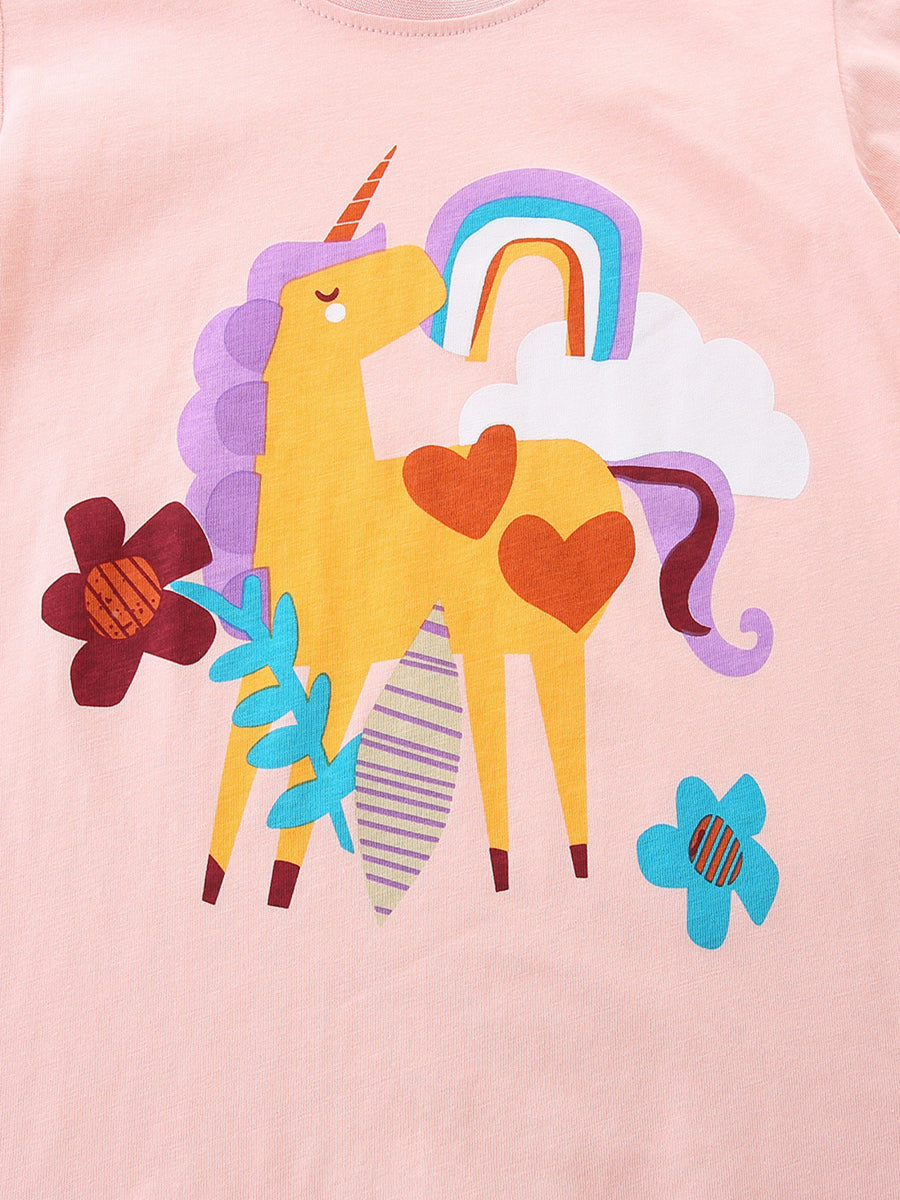 Children's blush pink cotton t-shirt with a yellow unicorn, rainbow, and flowers graphic.