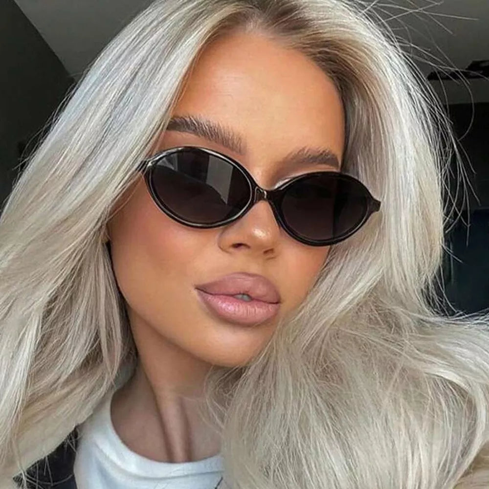 sunglasses in black featuring UV400 protection and oval fit