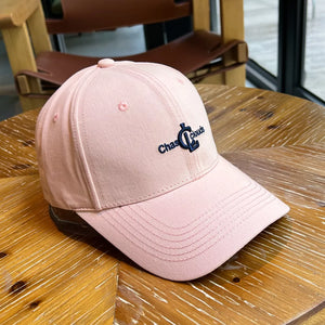 Pink baseball cap with embroidered logo detail