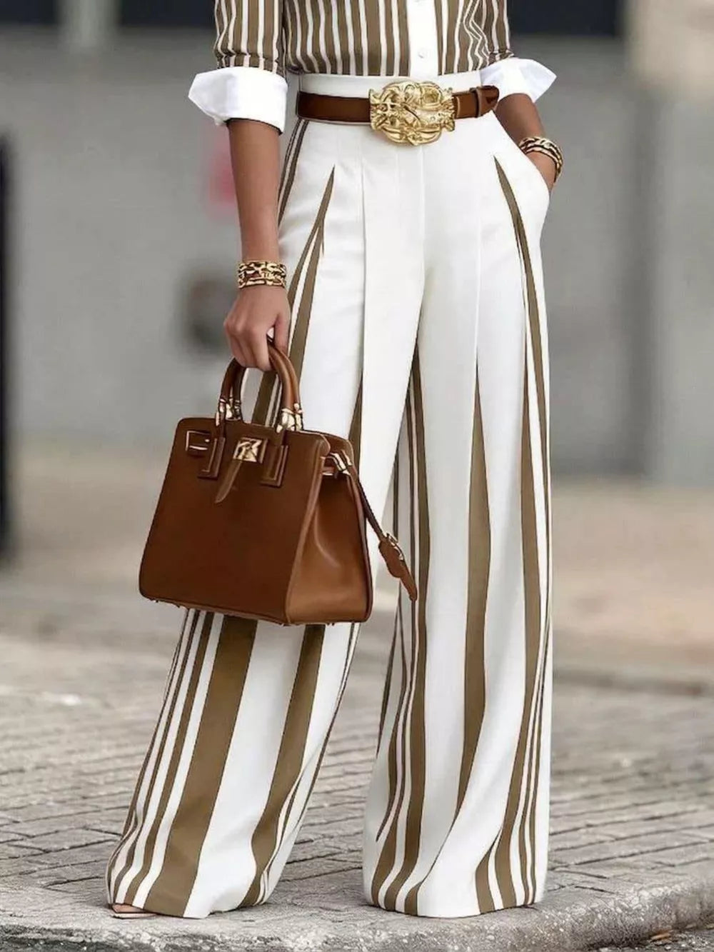 Wide-leg pants with brown and white vertical stripes, high waist, and pleats.