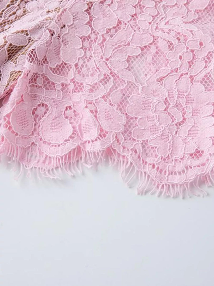 Pink lace midi dress detail with scalloped frayed hem