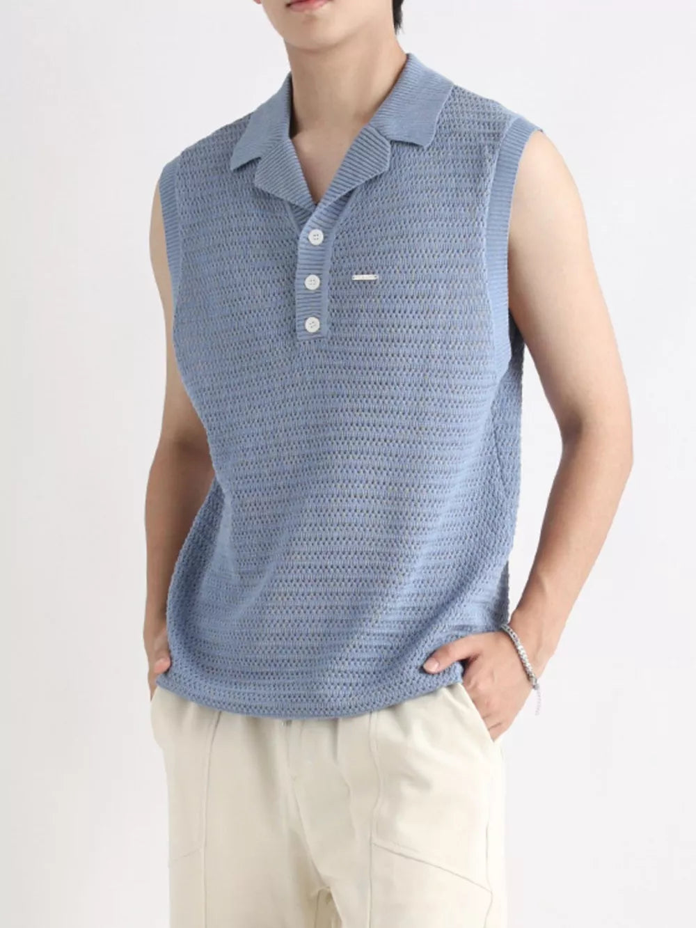Blue knit polo collar tank top with button placket and open weave texture.