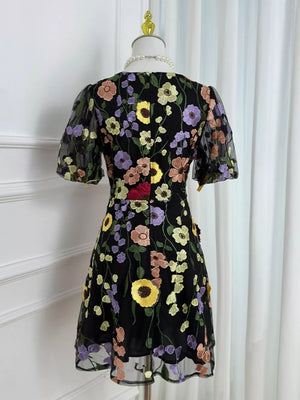 Black floral embroidered mesh dress with puff sleeves and scalloped hem
