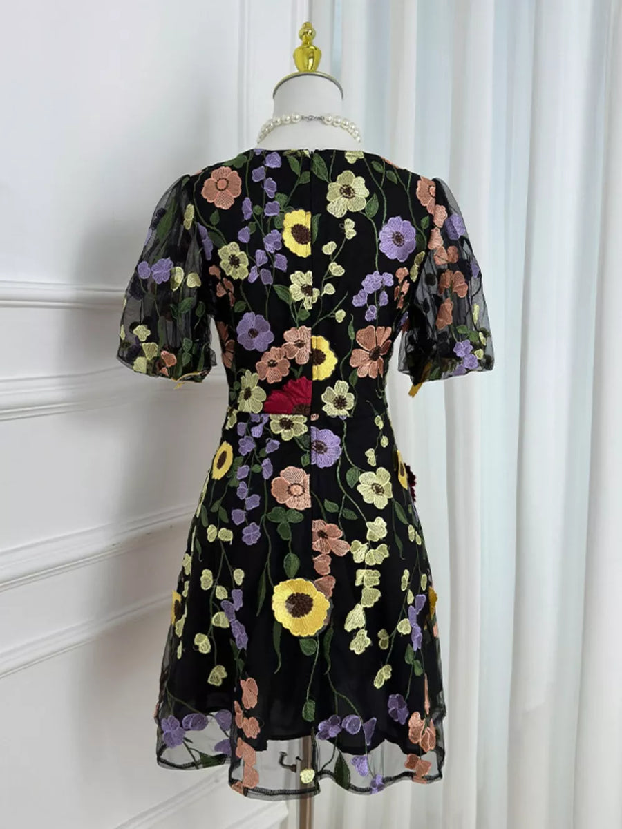 Black floral embroidered mesh dress with puff sleeves and scalloped hem